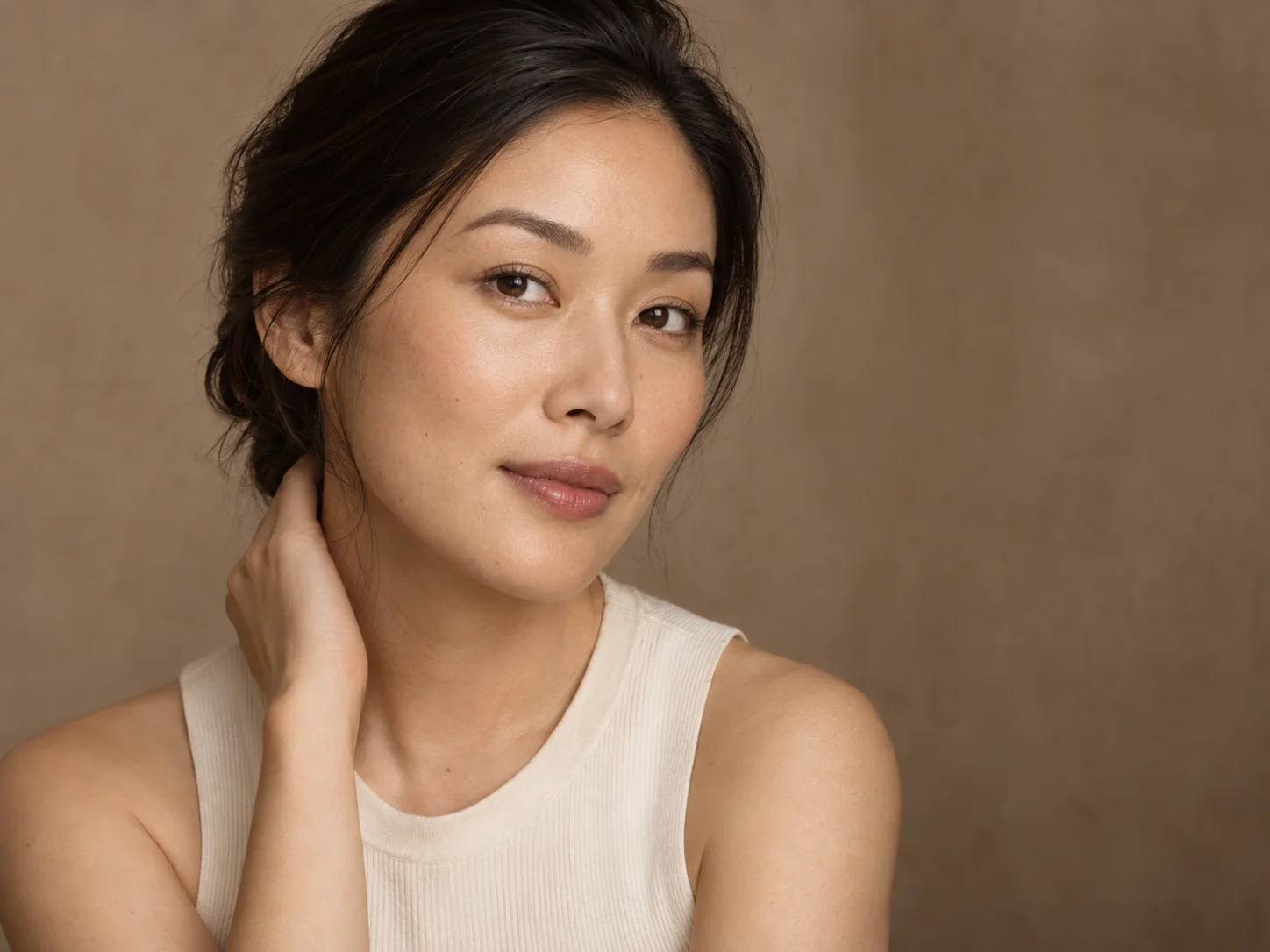 Illustrative portrait of a woman in soft natural light; not an OP CLINIC patient.